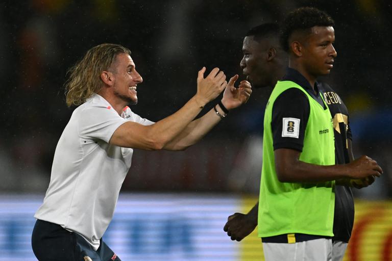 Ecuador's Argentine head coach Sebastian Beccacece and Ecuador's midfielder #23 Moises Caicedo celebrate at the end of the 2026 FIFA World Cup South American qualifiers football match between Colombia and Ecuador at the Metropolitano Roberto Melendez stadium in Barranquilla, Colombia, on November 19, 2024. (Photo by Raul ARBOLEDA / AFP) (Photo by RAUL ARBOLEDA/AFP via Getty Images)