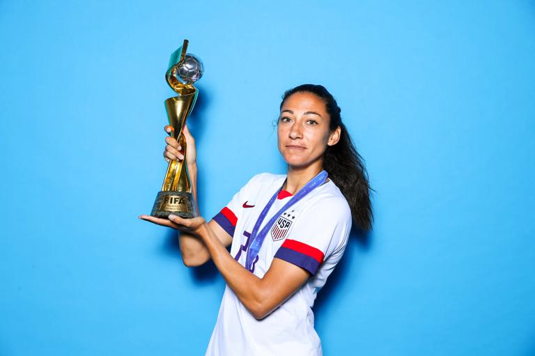 LYON, FRANCE - JULY 07: Christen Press of the USA poses with the Women's World Cup trophy after the 2019 FIFA Women's World Cup France Final match between The United State of America and The Netherlands at Stade de Lyon on July 07, 2019 in Lyon, France. (Photo by Naomi Baker - FIFA/FIFA via Getty Images)
