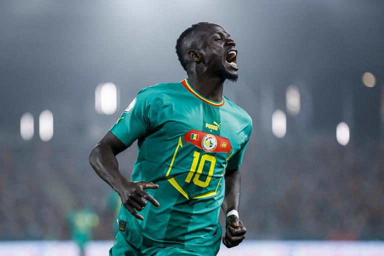 Senegal's midfielder #10 Sadio Mane celebrates after assisting on a goal during the Africa Cup of Nations (CAN) 2024 round of 16 football match between Senegal and Ivory Coast at the Stade Charles Konan Banny in Yamoussoukro on January 29, 2024. (Photo by KENZO TRIBOUILLARD / AFP) (Photo by KENZO TRIBOUILLARD/AFP via Getty Images)